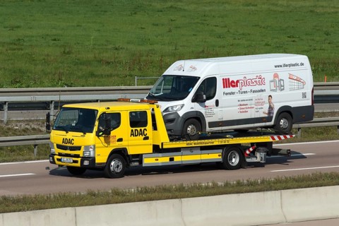 ADAC tow truck transports defective van on the A8 motorway