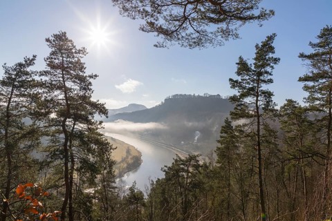 View from the Biedermann Mausoleum into the Elbe Valley with Koenigstein Fortress in the morning mist
