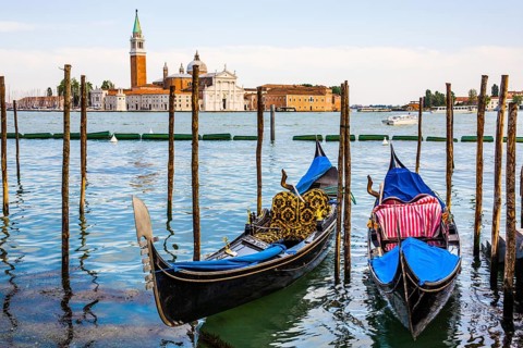 Gondolas in front of the evening panorama of San Giorgio Maggiore