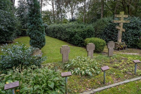 Gravestones for unknown Russian soldiers and orthodox Russian cross at the cemetery for Soviet prisoners of war from WW2