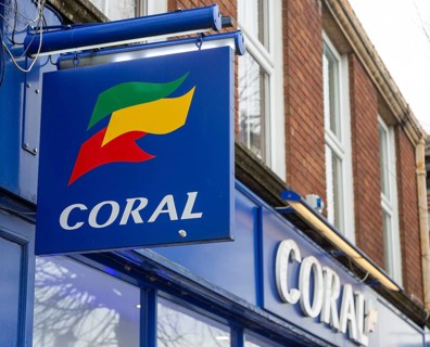 Wall mounted sign outside Coral bookmakers shop