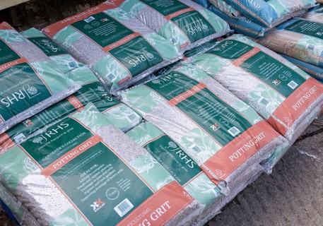 Bags of RHS potting grit piled up in garden centre