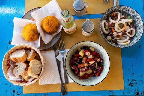 Seafood salad and arancine