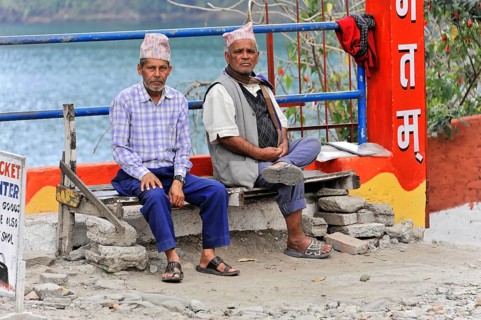 Two old Nepalese sitting on a bench at Lake Phewa