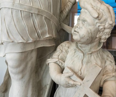 Marble statue of an ancient warrior with child in the staircase of the Humboldt Forum