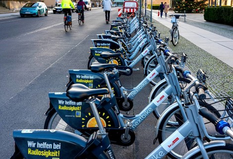 Electric rental bikes at the charging station in front of the Berlin House of Representatives