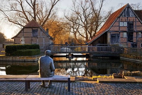 Bronze sculpture of the local poet Paul Advena at the water mill in Heek-Nienborg