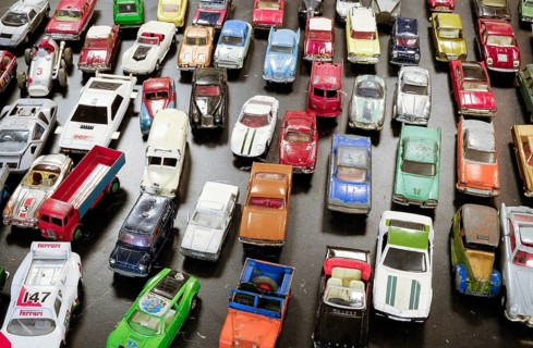 Old metal toy cars for sale at a flea market