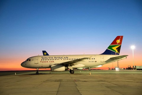South African Airline on tarmac at sunrise