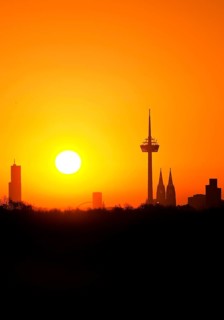 Sunrise over the city skyline with the Colonius telecommunications tower and the cathedral