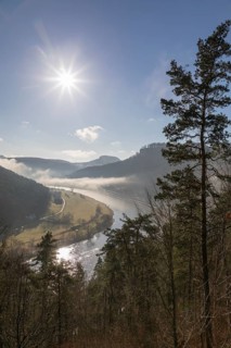 View from the Biedermann Mausoleum into the Elbe Valley with Koenigstein Fortress in the morning mist