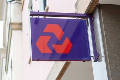 NatWest bank sign on wall outside branch