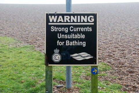 Sign warning of strong currents unsuitable for bathing