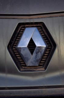 Renault car logo on dirty front panel