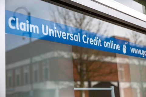 Claim Universal Credit online banner message in window of Job centre