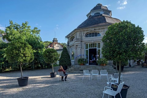 Spa guest sitting at the pavilion of the spa hotel in the spa garden