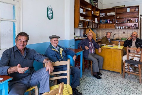 Elderly Greek men sitting in an improvised bar in the town of Kos