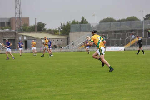 GAA player with hurley and ball during a game as Lixnaw win Kerry county hurling county final