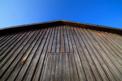 Wooden wall of a barn with sky