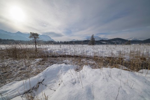 Lake Barmsee with Karwendel mountainrange on morning in winter