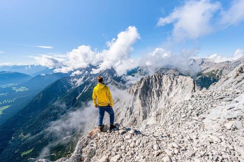 Hiker at the west summit of Hohe Munde