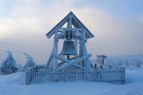 Peace bell on the summit of Fichtelberg with snow in winter