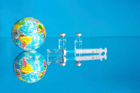 Vaccine bottles and syringe