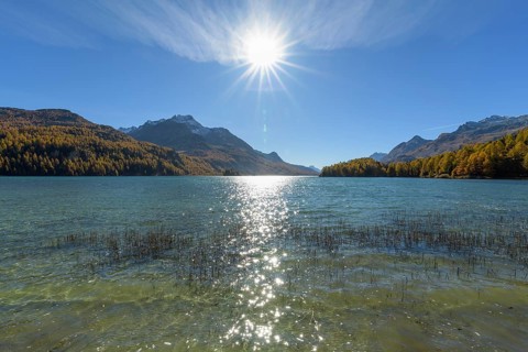 Lake Silsersee with sun in autumn