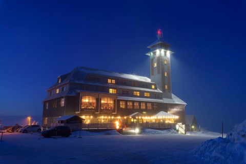 Fichtelberghaus on the summit of Fichtelberg at dusk in winter