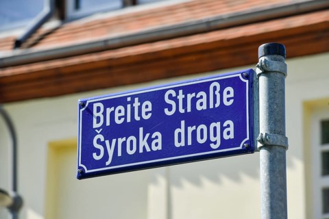 Multilingual street sign Sorbian and German