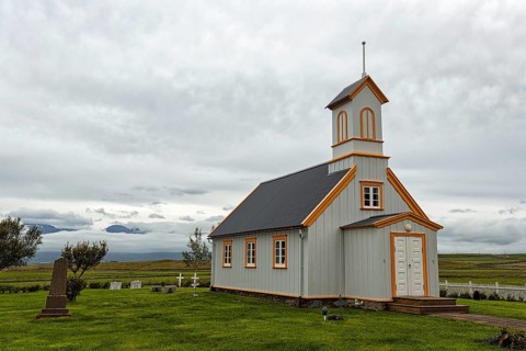 Small wooden church with cemetery