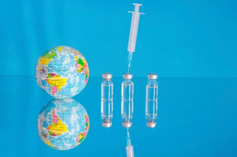 Vaccine bottles and syringe