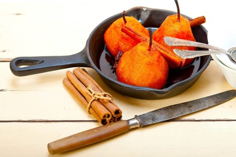 Poached pears delicious home made recipe ove white rustic wood table