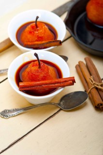 Poached pears delicious home made recipe ove white rustic wood table
