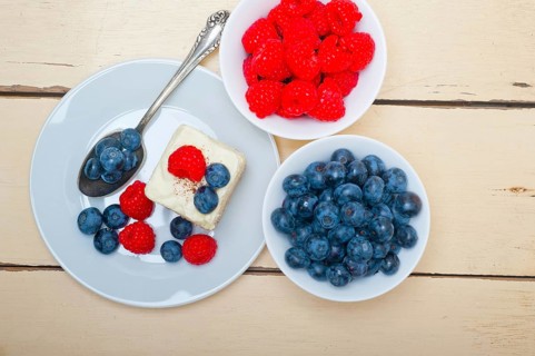 Fresh homemade raspberry and blueberry cream cake