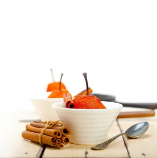 Poached pears delicious home made recipe ove white rustic wood table