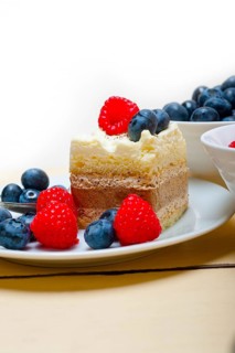 Fresh homemade raspberry and blueberry cream cake