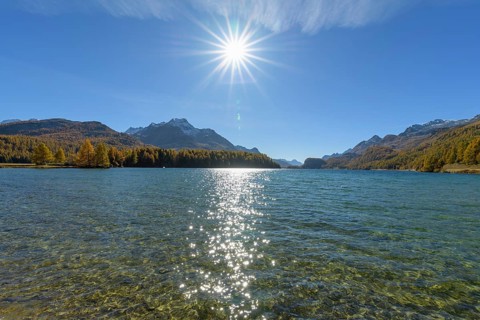 Lake Silsersee with sun in autumn