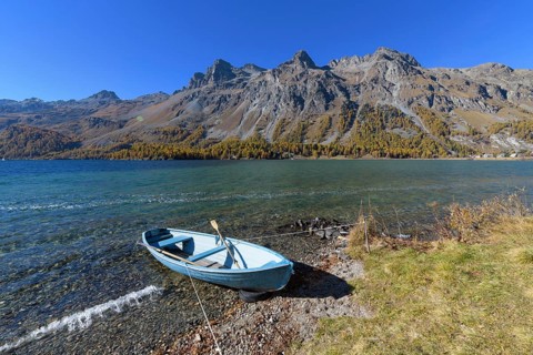 Lake with boat in autumn