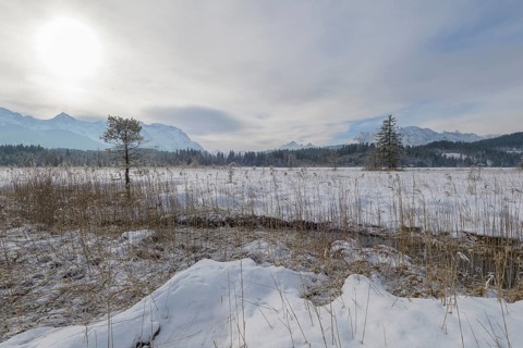 Lake Barmsee with Karwendel mountainrange on morning in winter