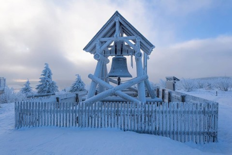 Peace bell on the summit of Fichtelberg with snow in winter