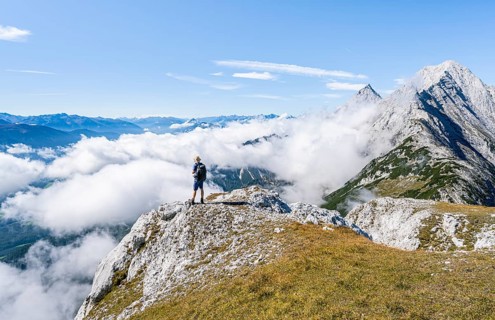 Hiker above the clouds