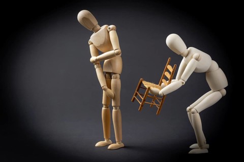 The mannequin hands over the chair
