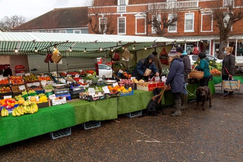 Market stall in town centre selling fruit and vegetables