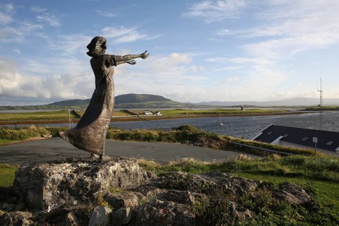 Niall Bruton emigration statue and landscape scene at Rosses Point. Sligo
