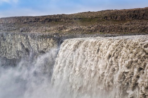 Hikers at the edge of Dettifoss