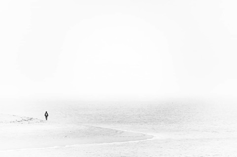 Single person on the shore of the North Sea