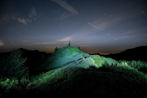 Peak lit by torch from Portlakopf