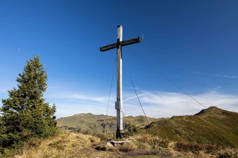 Summit cross in the morning light on Portlakopf