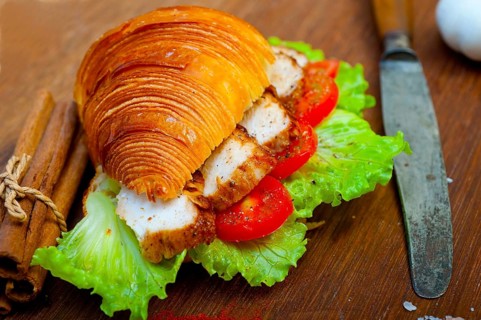 Savory croissant brioche bread with chicken breast and vegetable rustic style